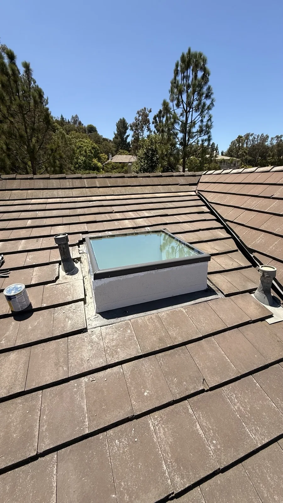 Custom curb-mounted skylight installed on a gravel flat roof in Brentwood, Los Angeles