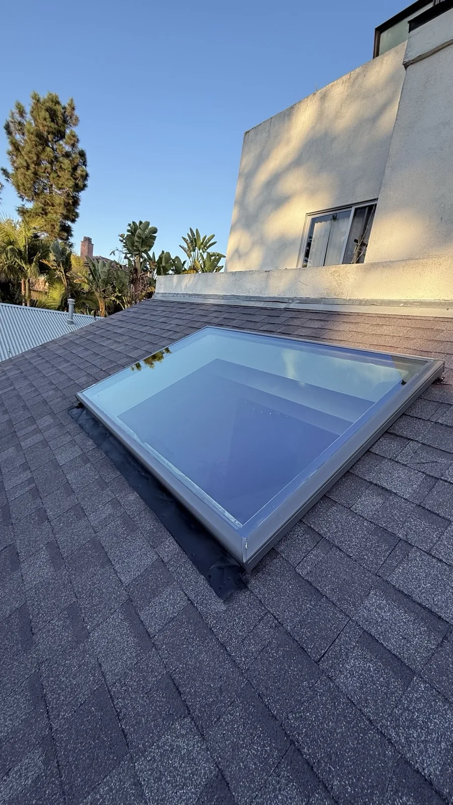 Velux FCM 4672 fixed skylight on an asphalt shingle roof in Los Angeles