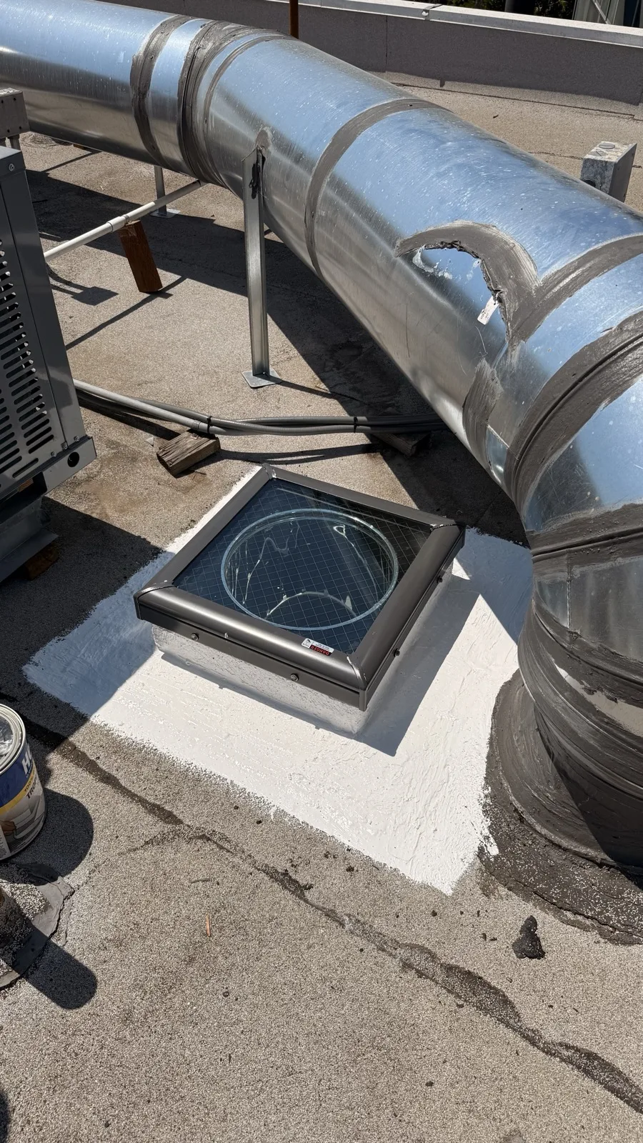 Solar tube skylight installation on a Spanish tile roof in Los Angeles
